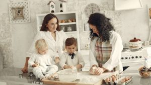 Three generations enjoying baking together in a cozy kitchen with natural light.